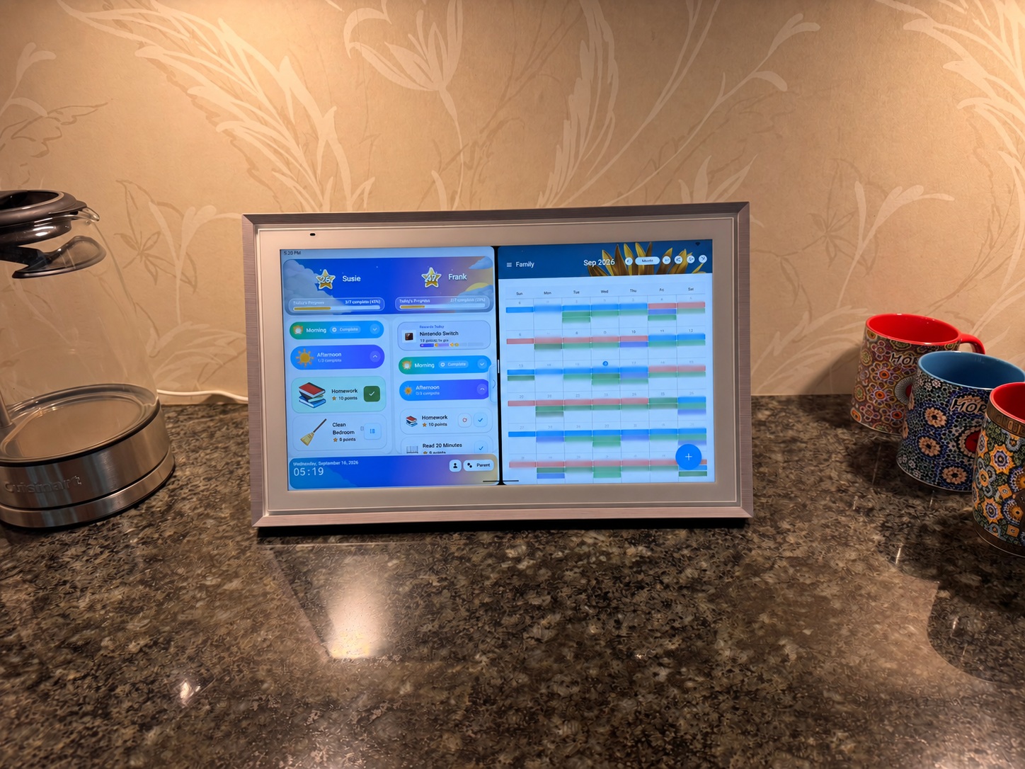 Wide kitchen view of MyChoreBoard and ApoloSign calendar in split screen